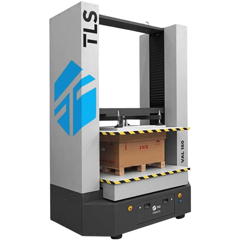 VAL-150 compression tester applying force on a palletized box, viewed from the front-right angle, with TLS logo visible.