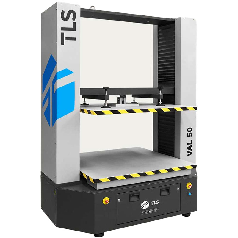 Angled view of the VAL-50 Box Compression Tester with striped platforms and TLS logo.